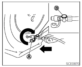 Nissan Kicks emergency tire repair kit hose connected to tire valve